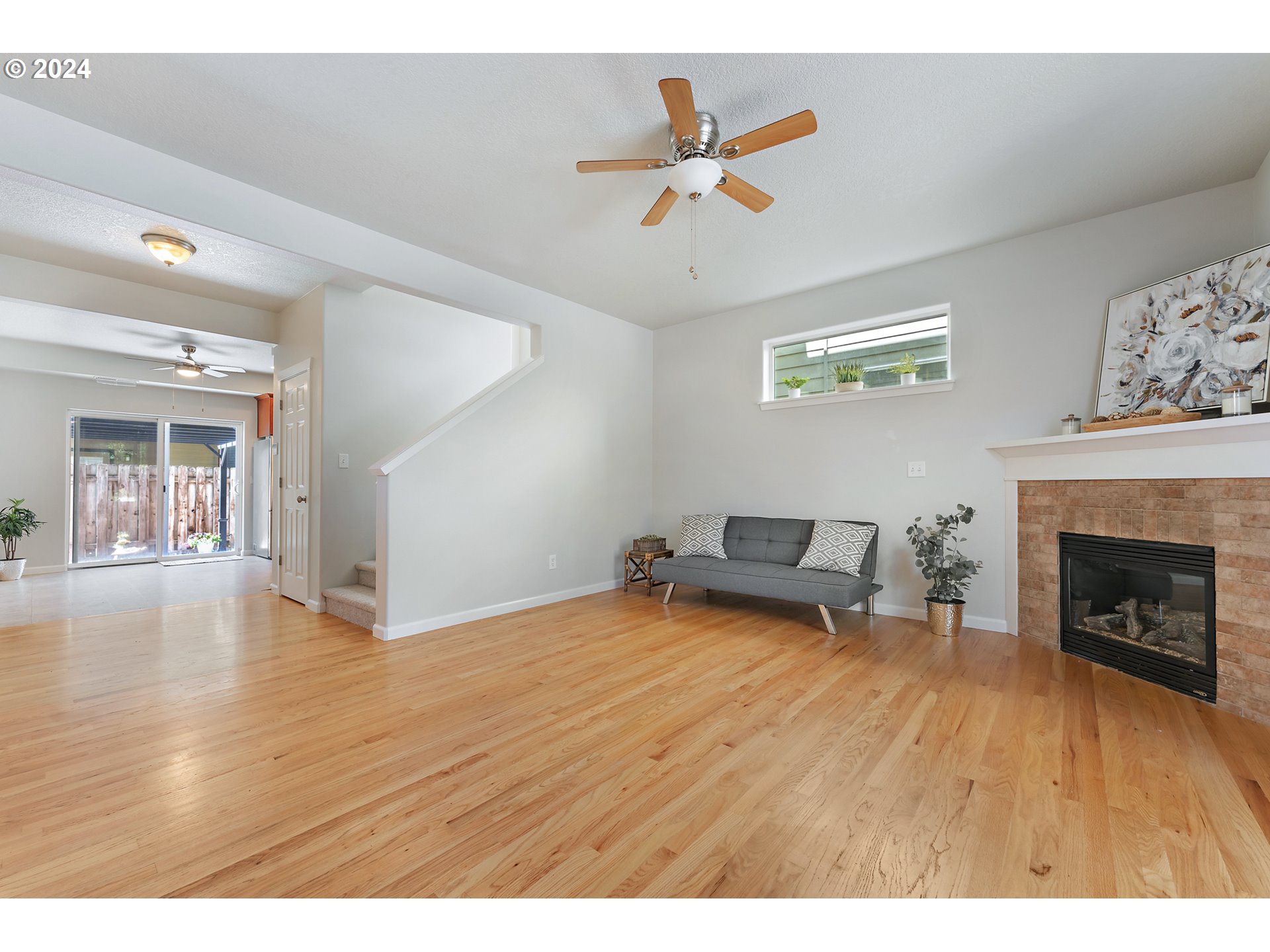 3149 Southwest 173rd Avenue Beaverton, OR 97003 - Photo 5 of 35 a view of empty room with fireplace and wooden floor