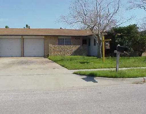 a view of a house with a yard and garage