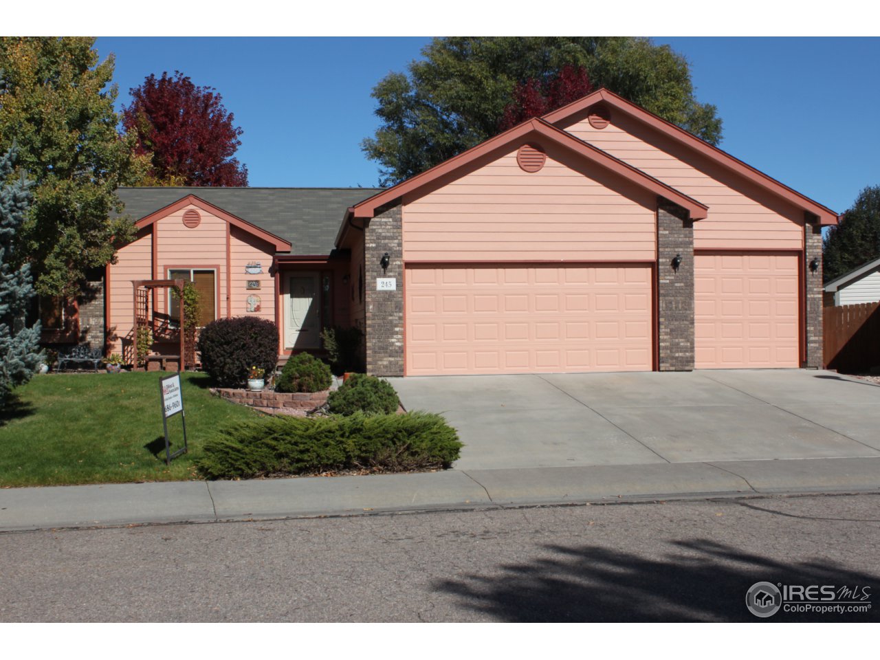 245 Sequoia Circle Windsor, CO 80550 - Photo 1 of 15 a front view of house with garage and green space