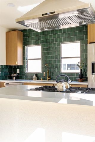 a kitchen with a sink and a window