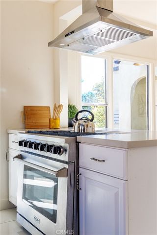 a kitchen with a stove and a sink