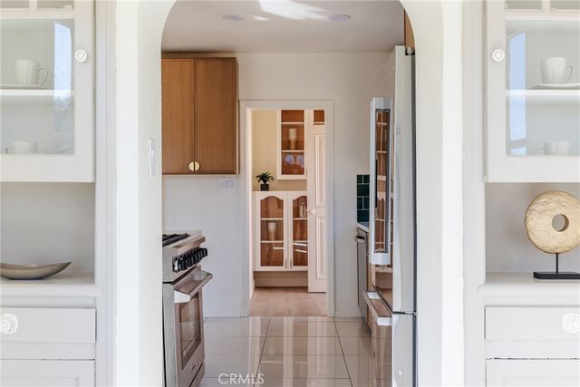 a bedroom with a bed and a chair