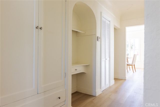 a bedroom with a bed and a mirror