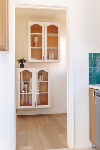 a view of a house with a wooden fence