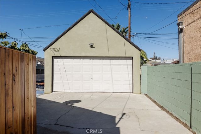 a view of backyard with deck and wooden floor