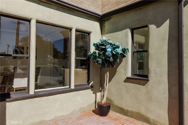 a vase of flowers sitting on a floor