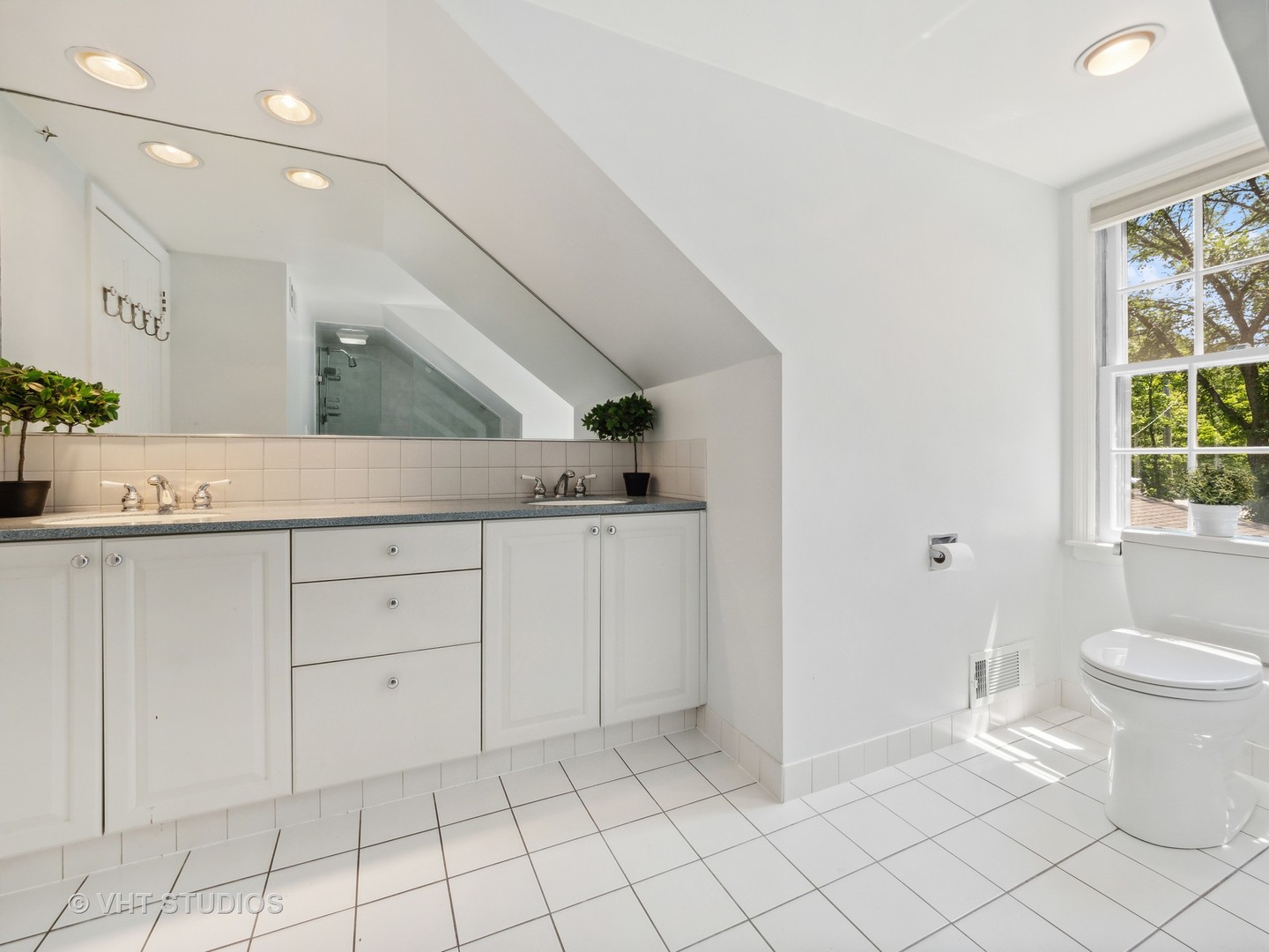 940 Shermer Road Northbrook, IL 60062 - Photo 13 of 41 a spacious bathroom with a sink a toilet and a mirror