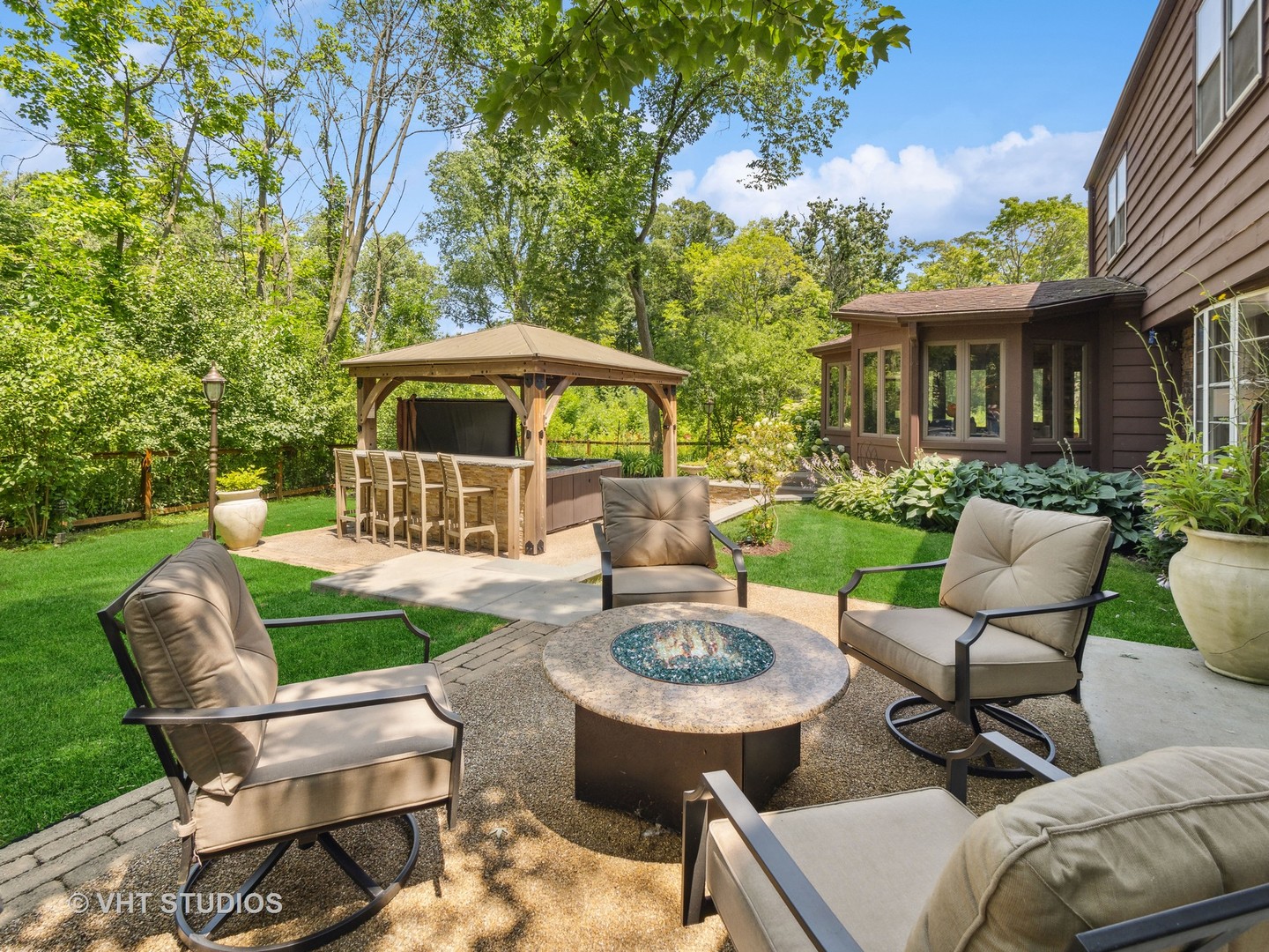 940 Shermer Road Northbrook, IL 60062 - Photo 18 of 41 a view of a patio with couches chairs and a fire pit