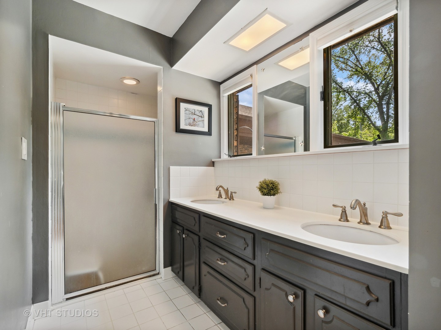 940 Shermer Road Northbrook, IL 60062 - Photo 5 of 41 a bathroom with a double vanity sink mirror and window
