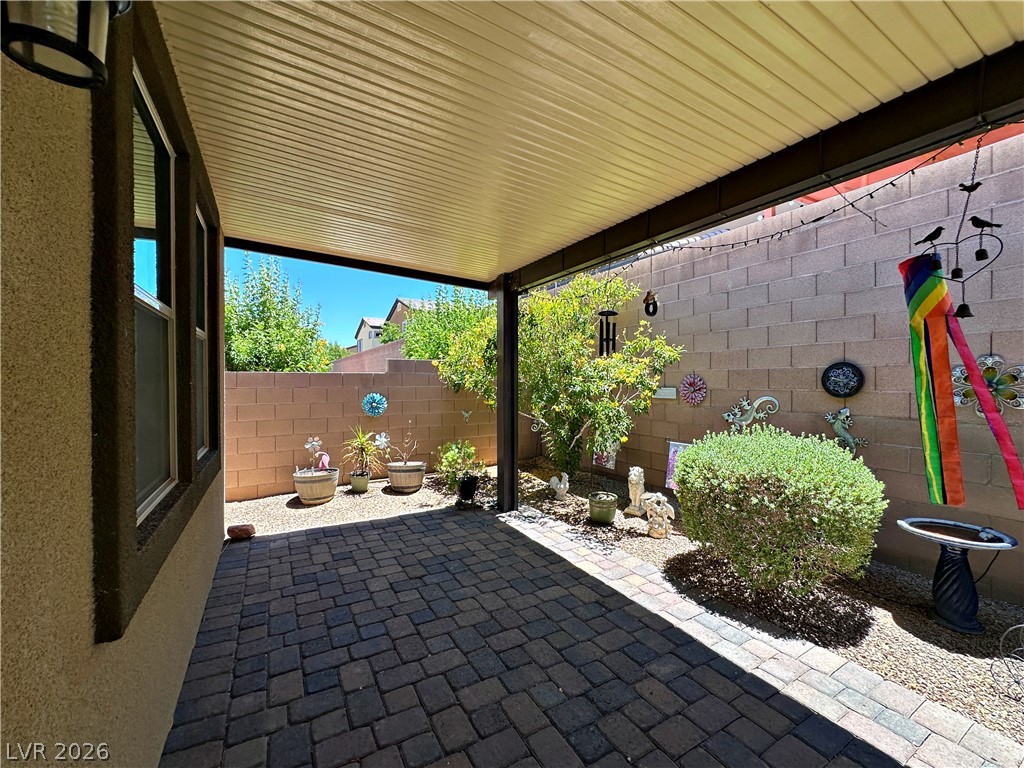 71 Newton Ridge Way Las Vegas, NV 89183 - Photo 36 of 40 An inviting covered patio offers ample space for outdoor living and entertaining.