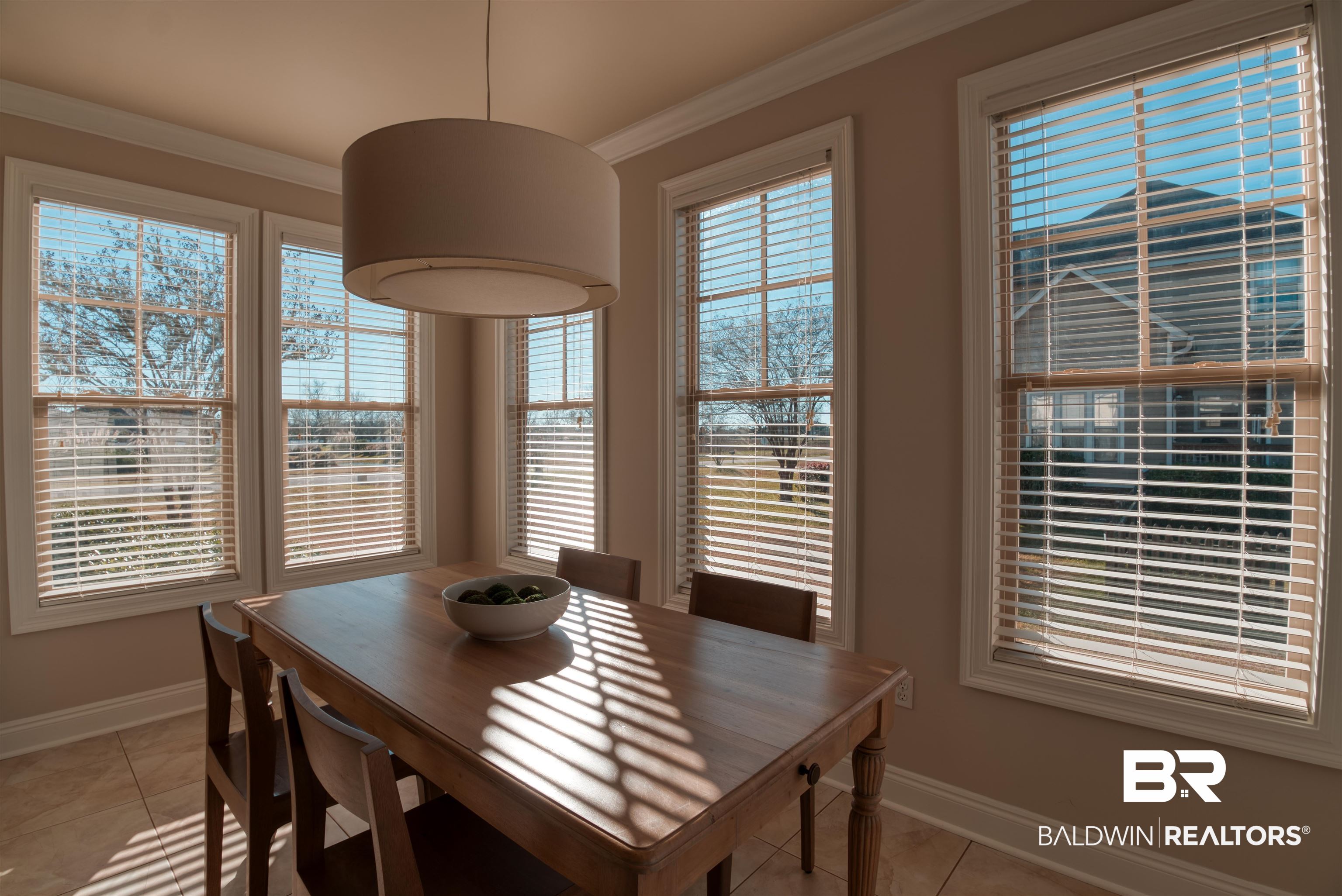 24561 Austin Road Daphne, AL 36526 - Photo 12 of 57 Dining room featuring light tile patterned floors, ornamental molding, and a wealth of natural light