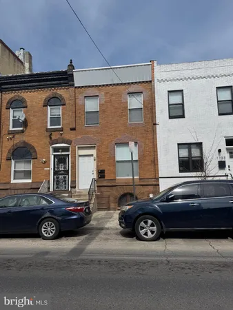 a car parked in front of a house