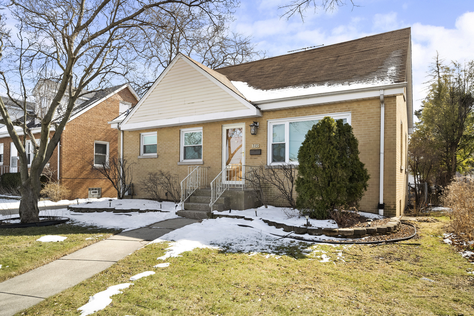 349 East Quincy Street Riverside, IL 60546 - Photo 1 of 26 a view of a house with snow on the wall