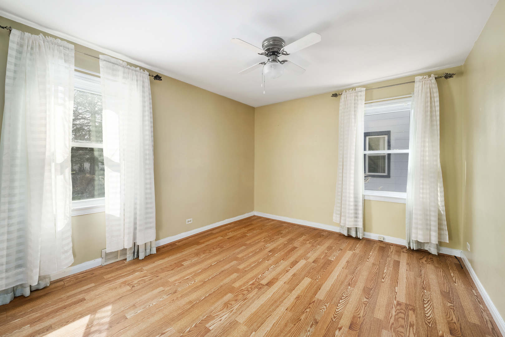 349 East Quincy Street Riverside, IL 60546 - Photo 14 of 26 wooden floor in an empty room with a window