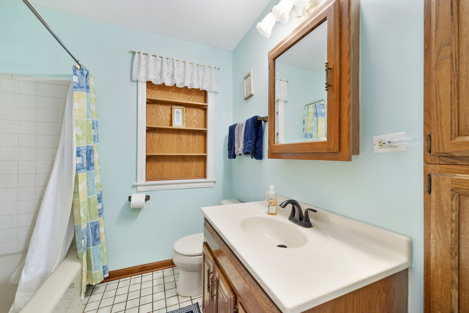 349 East Quincy Street Riverside, IL 60546 - Photo 15 of 26 a bathroom with a sink a toilet and a mirror