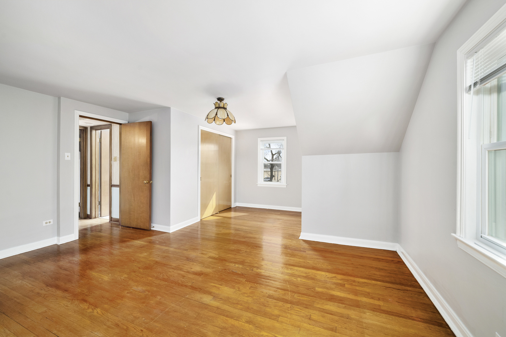 349 East Quincy Street Riverside, IL 60546 - Photo 16 of 26 wooden floor in an empty room with a window