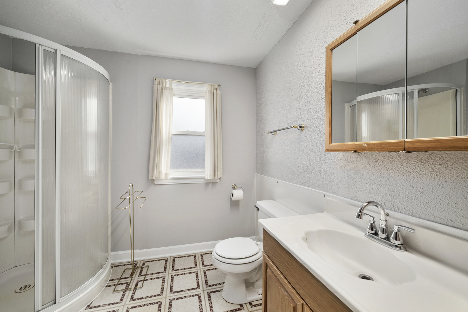 349 East Quincy Street Riverside, IL 60546 - Photo 19 of 26 a bathroom with a sink a toilet and shower