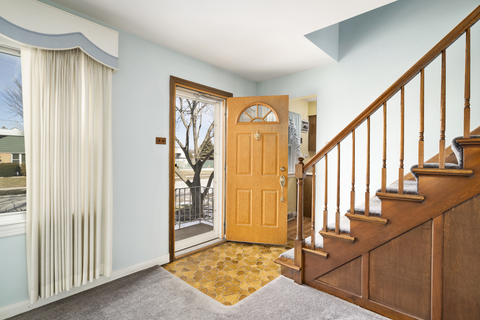 349 East Quincy Street Riverside, IL 60546 - Photo 4 of 26 a view of an entryway with wooden floor and door