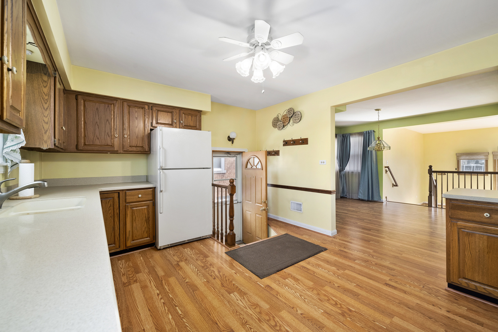 349 East Quincy Street Riverside, IL 60546 - Photo 9 of 26 a kitchen with a refrigerator cabinets and wooden floor