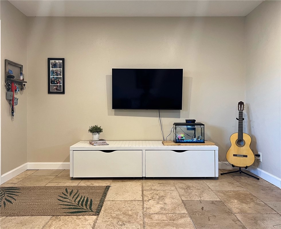 1807 Barbara Street Austin, TX 78757 - Photo 7 of 25 a living room with a flat screen tv and a couch