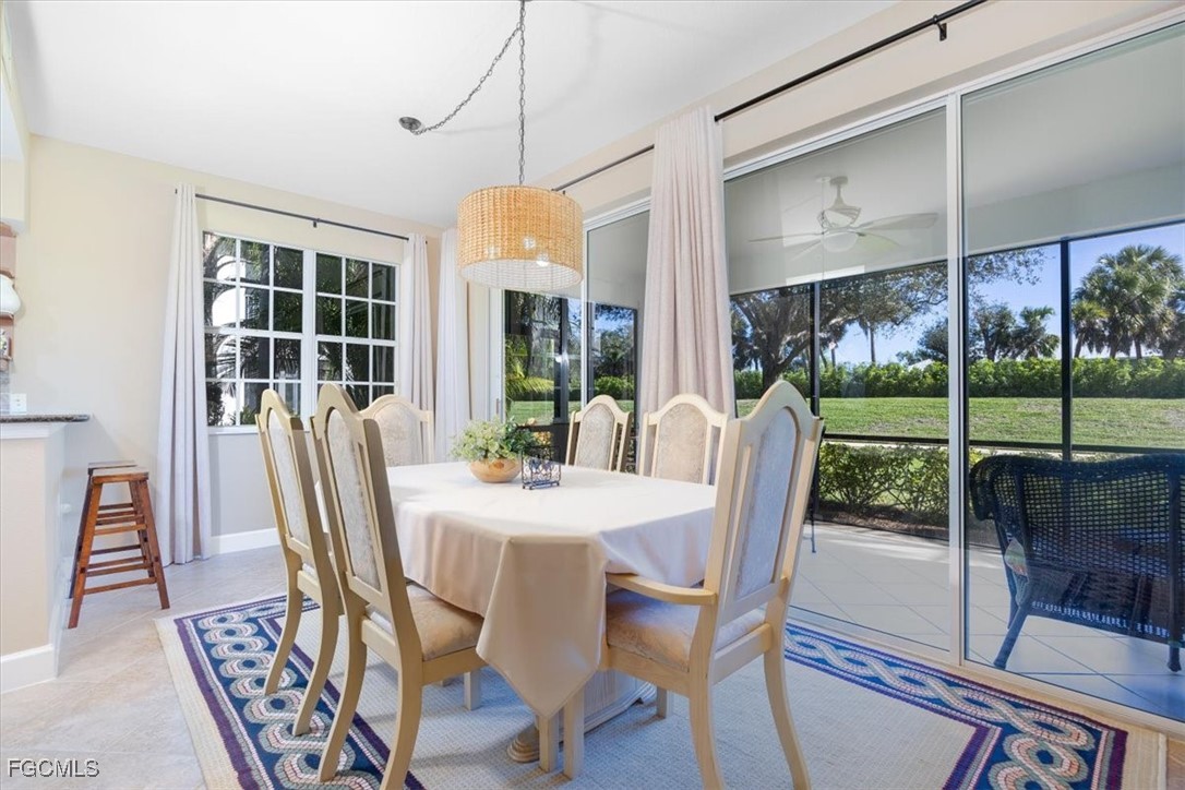 13091 Pebblebrook Ridge Court, Unit 101 Fort Myers, FL 33905 - Photo 11 of 39 a view of a dining room with furniture window and outside view