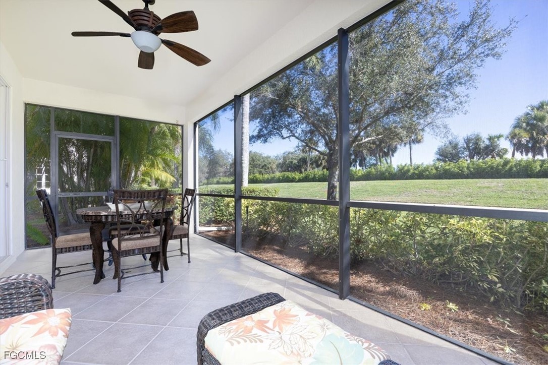 13091 Pebblebrook Ridge Court, Unit 101 Fort Myers, FL 33905 - Photo 15 of 39 a dining room with furniture and a garden view