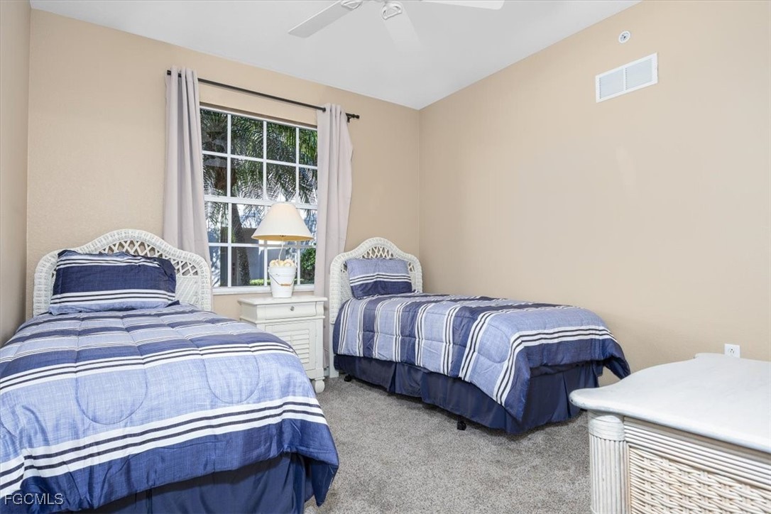 13091 Pebblebrook Ridge Court, Unit 101 Fort Myers, FL 33905 - Photo 25 of 39 a bedroom with a bed and window