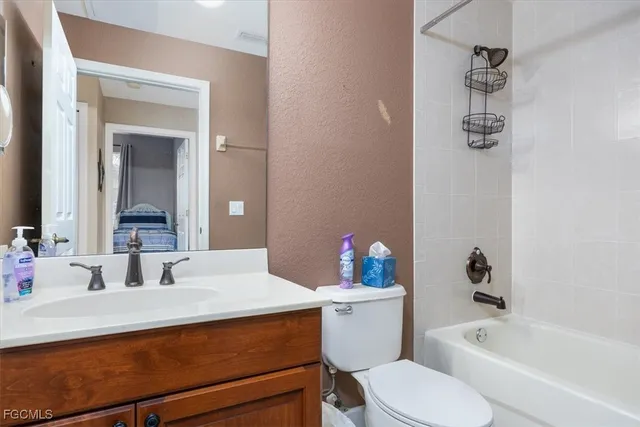 a bathroom with a sink a toilet and bathtub