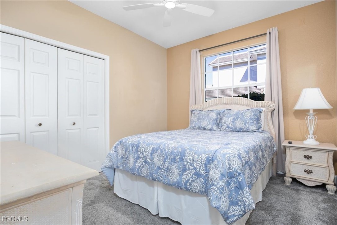 13091 Pebblebrook Ridge Court, Unit 101 Fort Myers, FL 33905 - Photo 27 of 39 a bedroom with a bed and a window