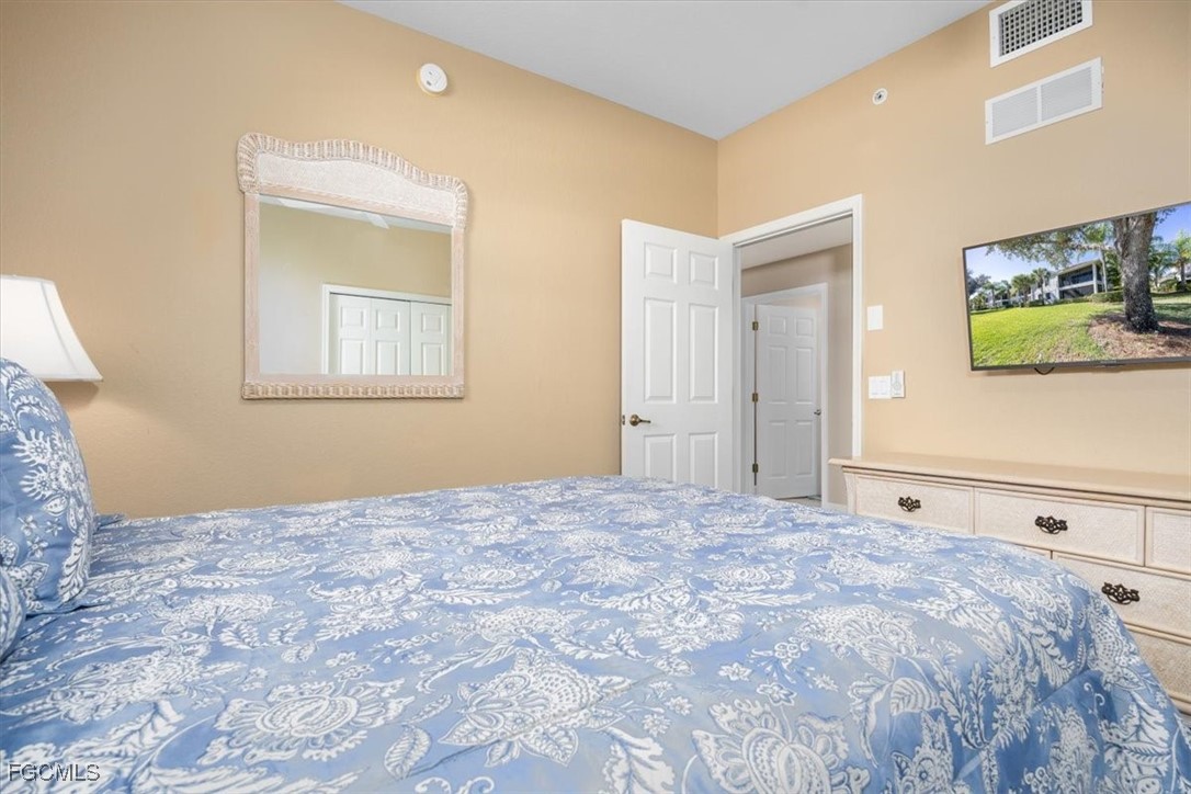 13091 Pebblebrook Ridge Court, Unit 101 Fort Myers, FL 33905 - Photo 28 of 39 a view of a bedroom with closet area