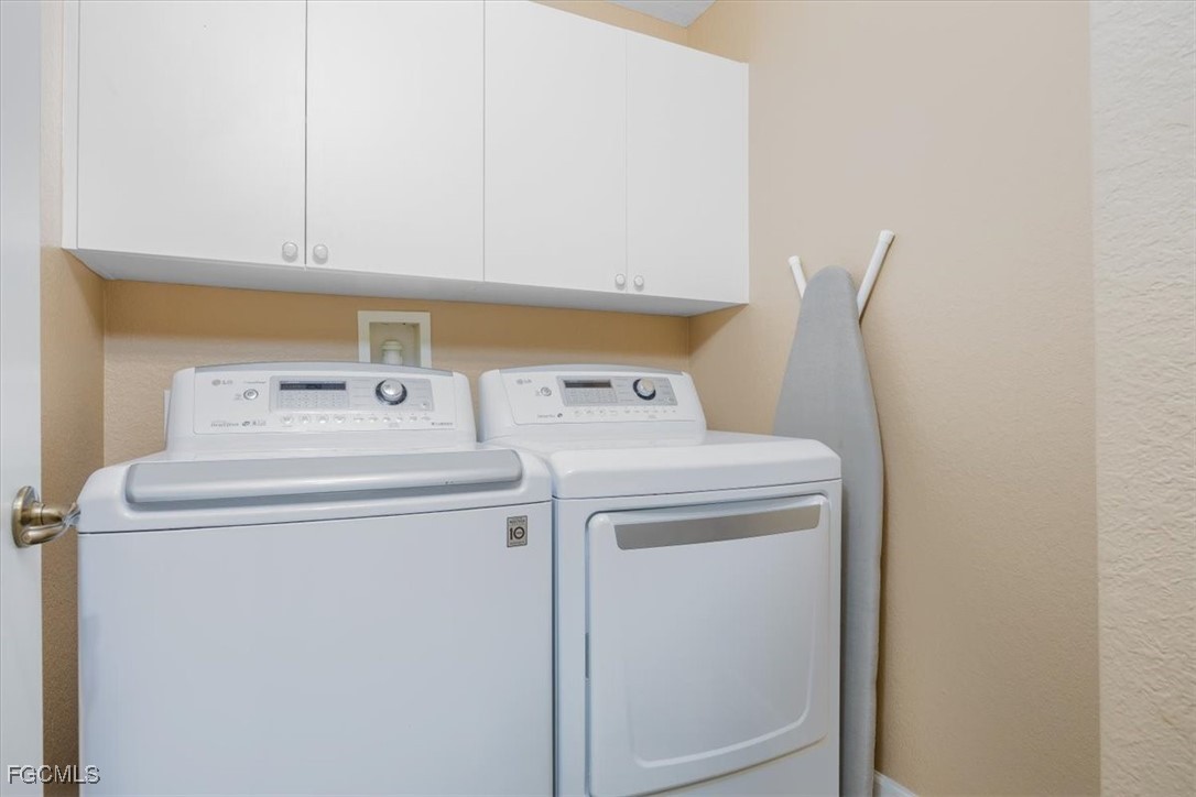13091 Pebblebrook Ridge Court, Unit 101 Fort Myers, FL 33905 - Photo 29 of 39 a utility room with dryer and washer