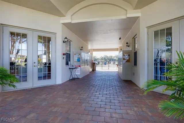a view of a hallway with dining area