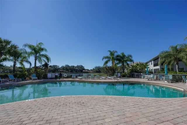 a view of a swimming pool with a yard
