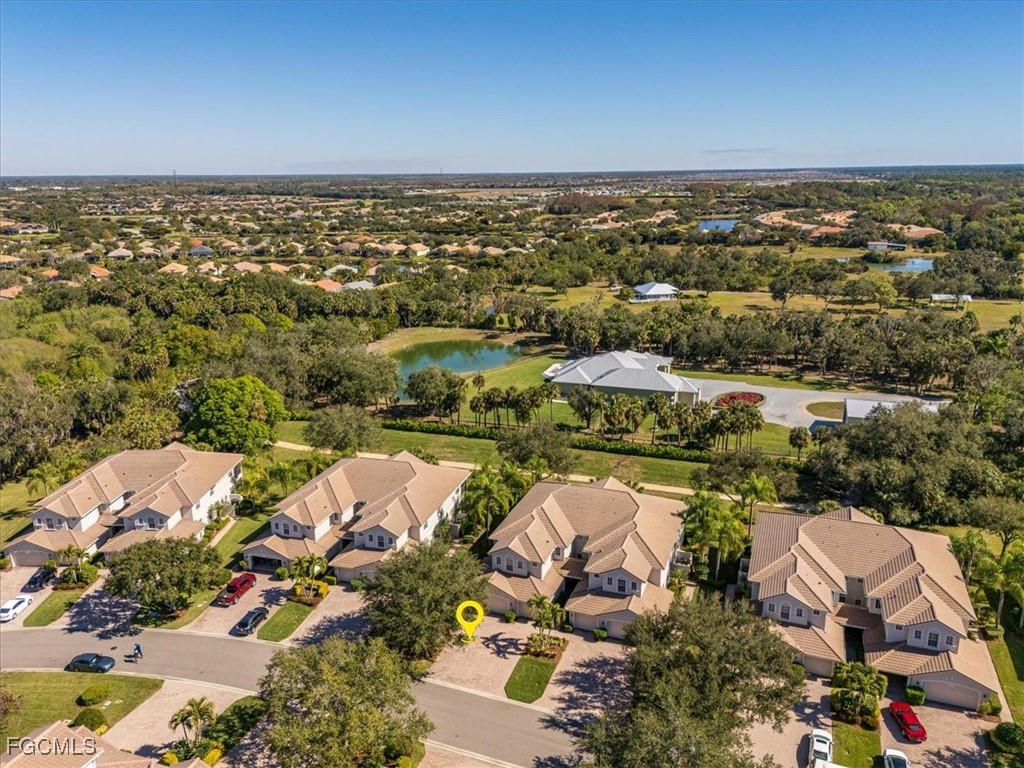 13091 Pebblebrook Ridge Court, Unit 101 Fort Myers, FL 33905 - Photo 37 of 39 an aerial view of residential houses with outdoor space