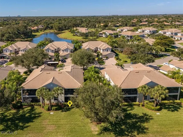 a view of a garden with a bench in the background