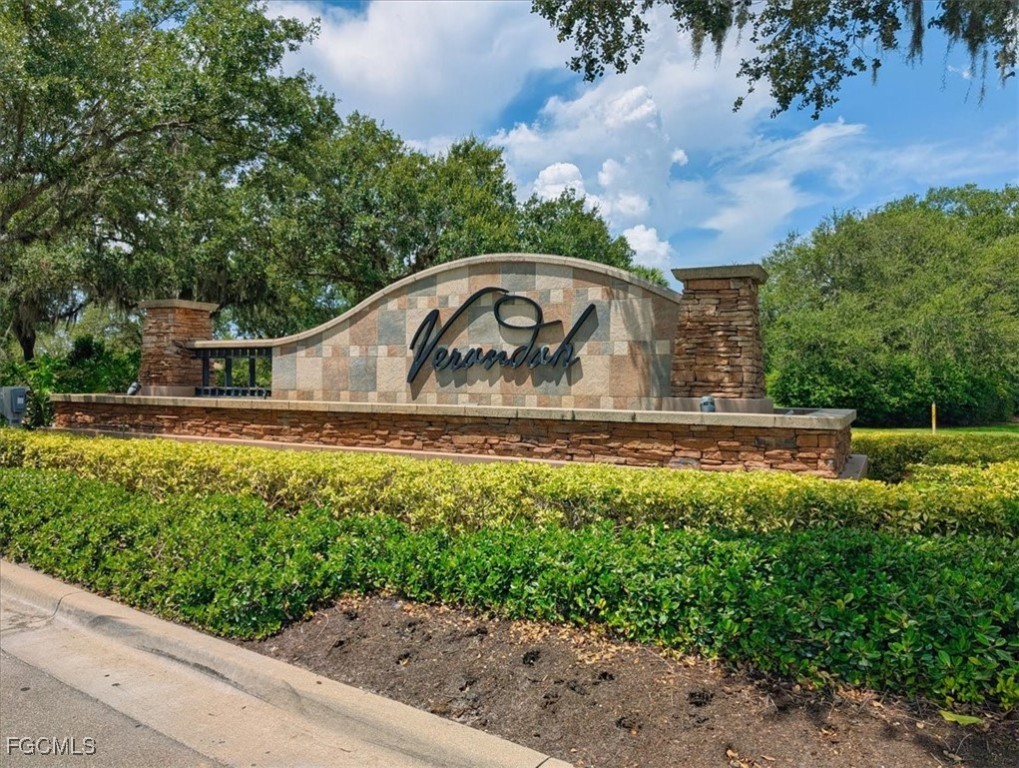 13091 Pebblebrook Ridge Court, Unit 101 Fort Myers, FL 33905 - Photo 39 of 39 a view of a garden with a bench in the background