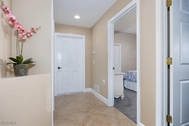 a view of a bathroom from a hallway