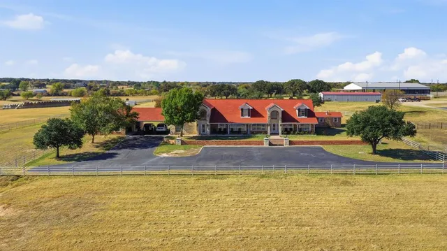 a view of a swimming pool and an outdoor seating