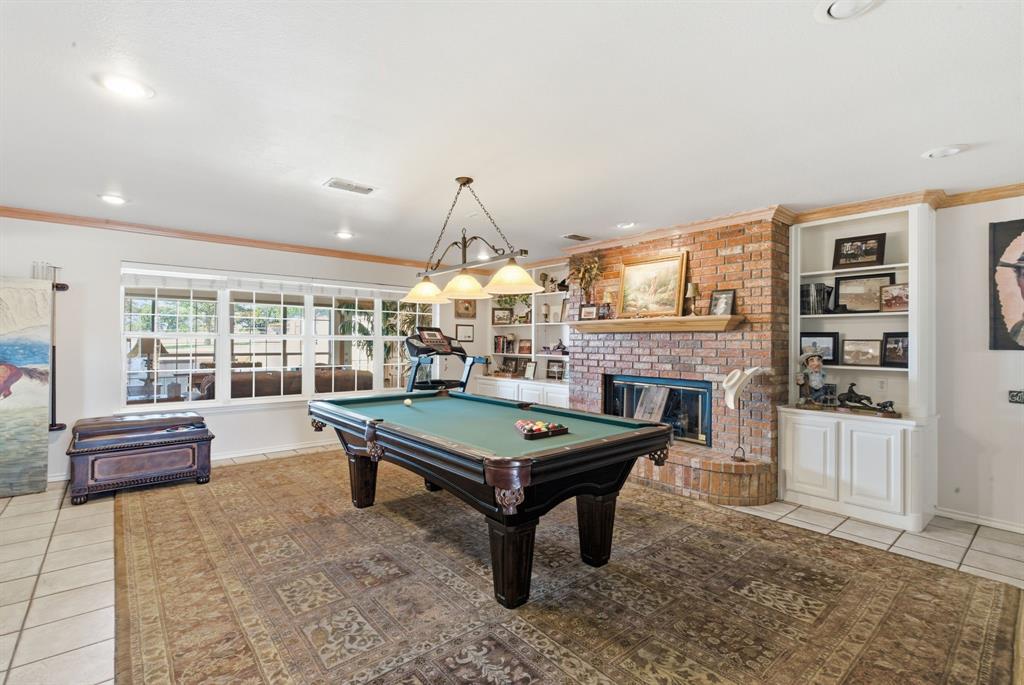 2691 North Fm Road 51 Springtown, TX 76082 - Photo 15 of 40 a room with pool table table and windows