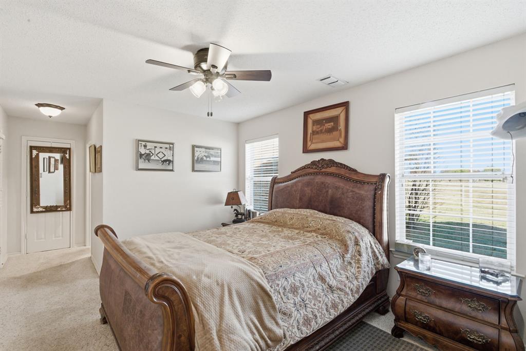 2691 North Fm Road 51 Springtown, TX 76082 - Photo 16 of 40 a bedroom with a bed and a window