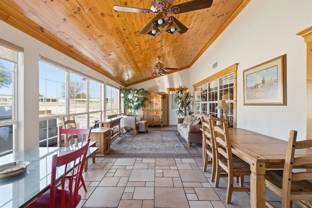 2691 North Fm Road 51 Springtown, TX 76082 - Photo 19 of 40 a living room with furniture a chandelier