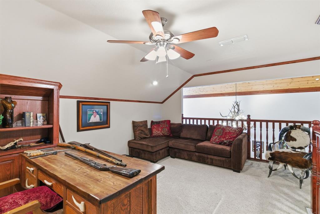 2691 North Fm Road 51 Springtown, TX 76082 - Photo 22 of 40 a living room with furniture and a flat screen tv