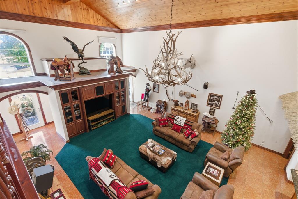 2691 North Fm Road 51 Springtown, TX 76082 - Photo 23 of 40 a living room with furniture and a fireplace