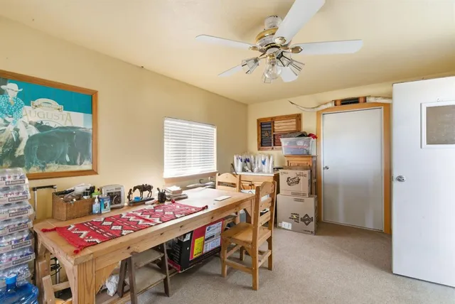 a dining room with furniture and window