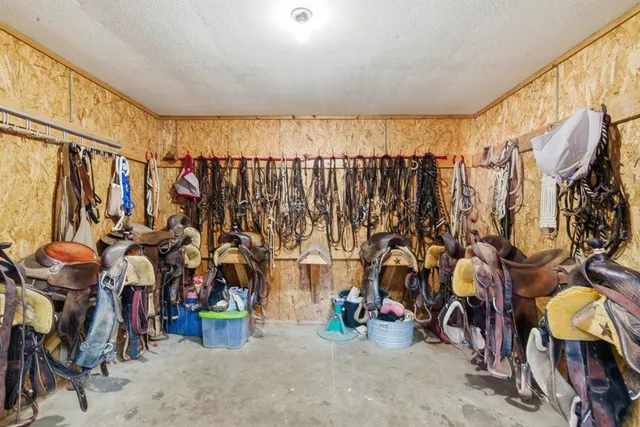 a view of walk in closet with clothes