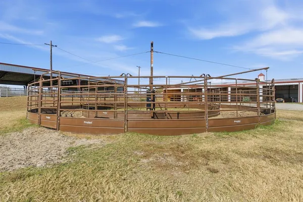 a view of a house with pool and sitting area