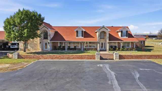 a view of pool with brick walls