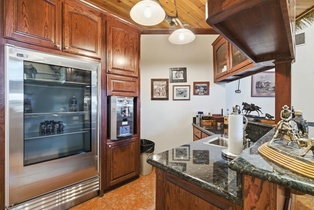 2691 North Fm Road 51 Springtown, TX 76082 - Photo 10 of 40 a kitchen with stainless steel appliances granite countertop a sink and cabinets