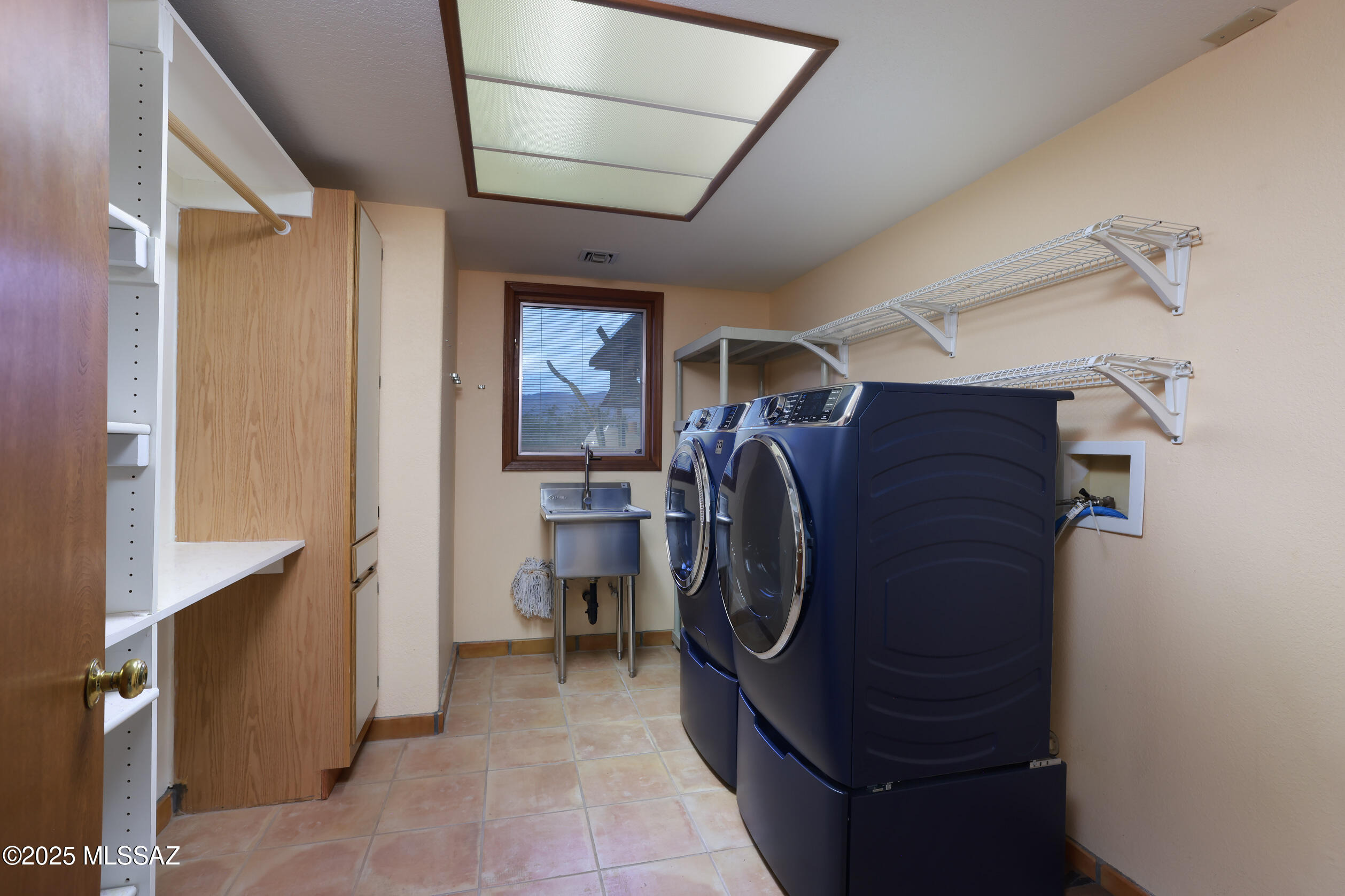 925 North Rancho Del Jefe Loop Tucson, AZ 85748 - Photo 39 of 52 a utility room with dryer and washer