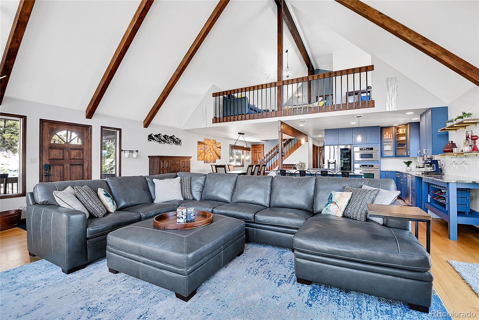 1567 Tapadero Road Bailey, CO 80421 - Photo 3 of 26 a living room with furniture and a ceiling fan